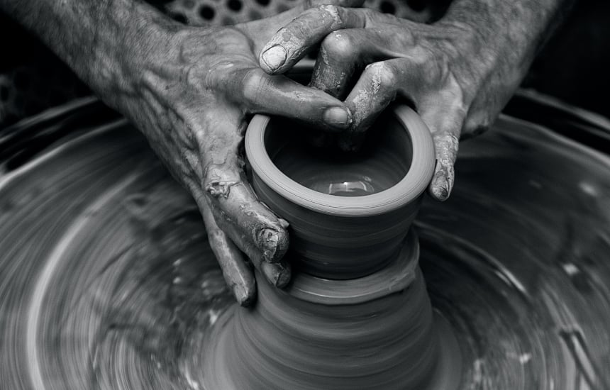 Hands crafting a pot as example of the skills that a project manager needs.