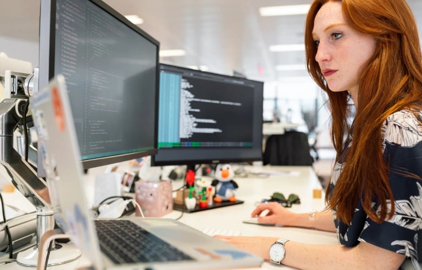 women working on coding