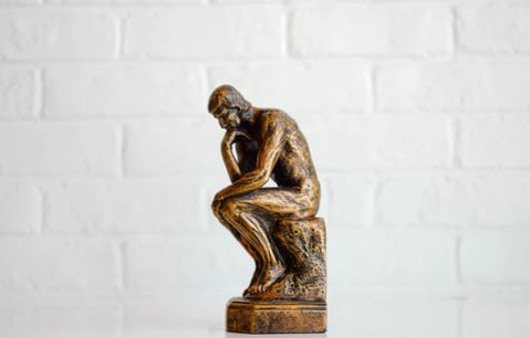 Statue sitting questioning about life 