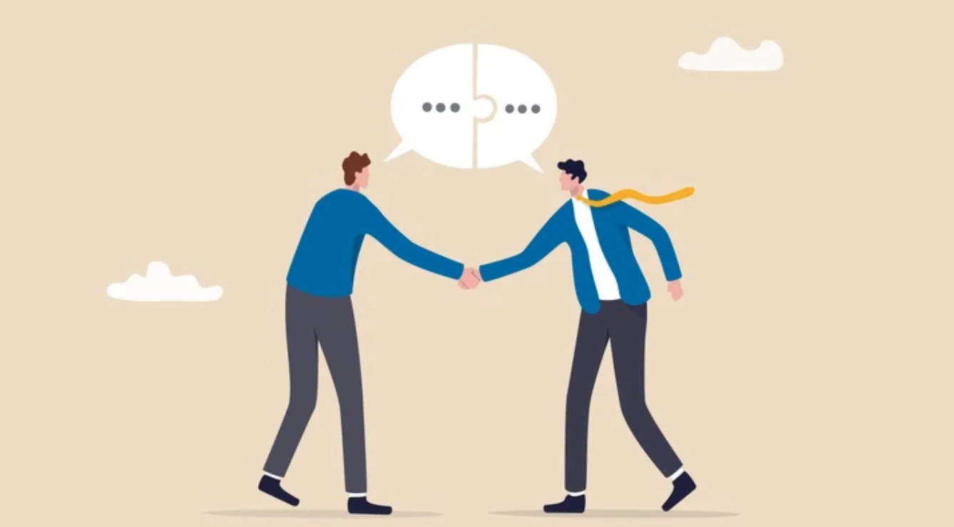 The Power of Collaboration: Enhancing Team Performance Tactics 2 picture of two men shaking hands